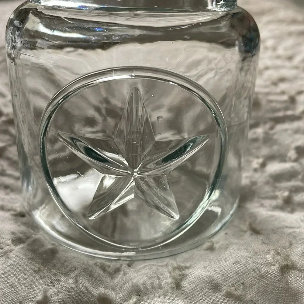 Clear Glass Jar 3D Star on Front. Black Metal Handle. Patio decor. Candle holder